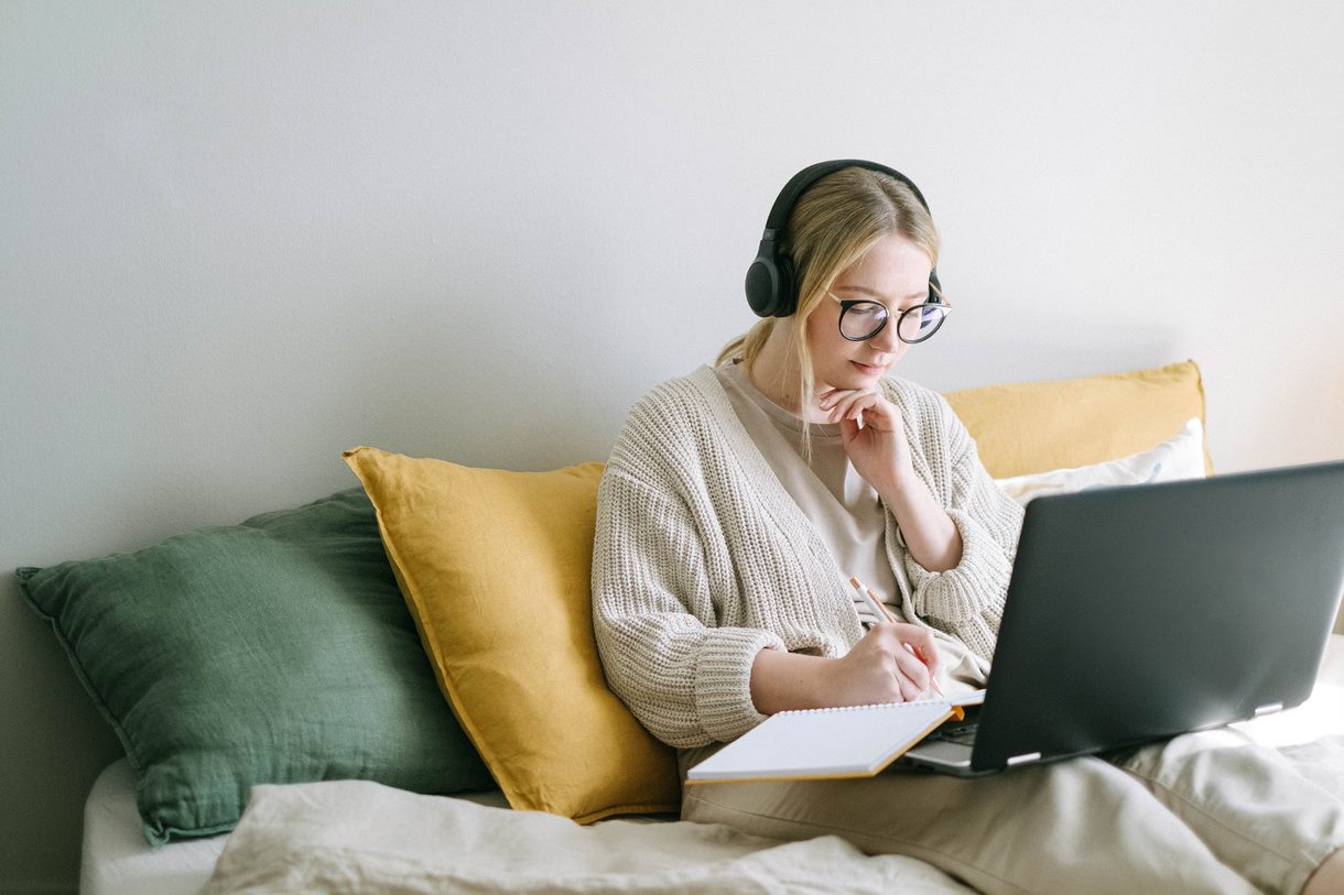 Photo of a young woman using a laptop